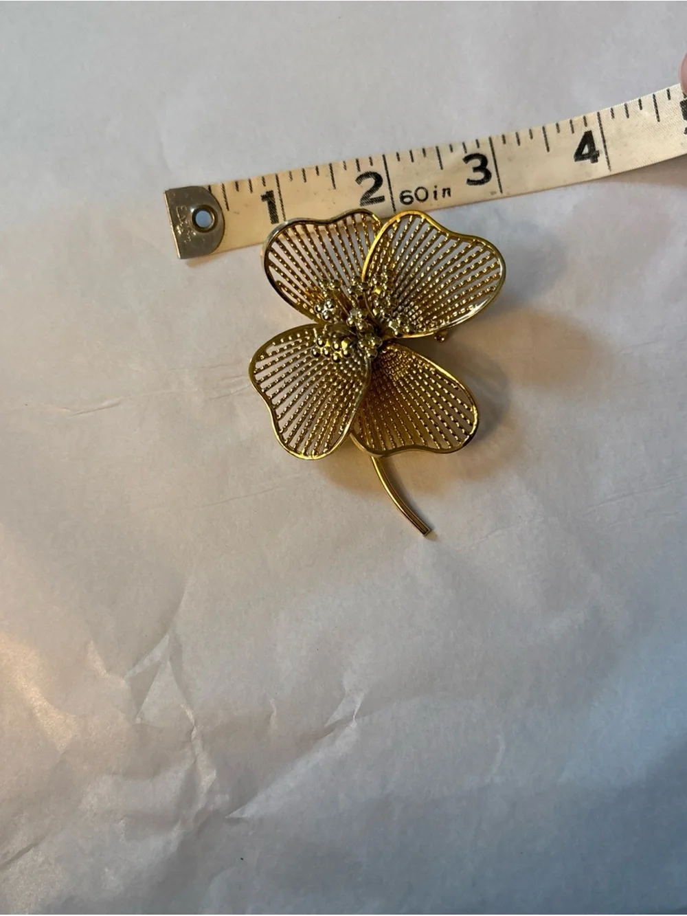 Gold Tone  4 Leaf Clover or flower brooch. Approximately 3 inches.